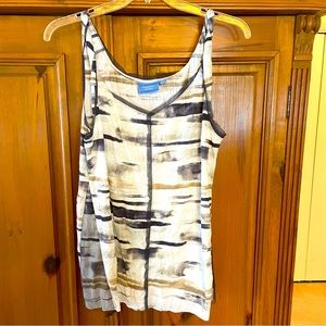 Never worn. Cute tank. Front straps are twisted. Mesh detail.